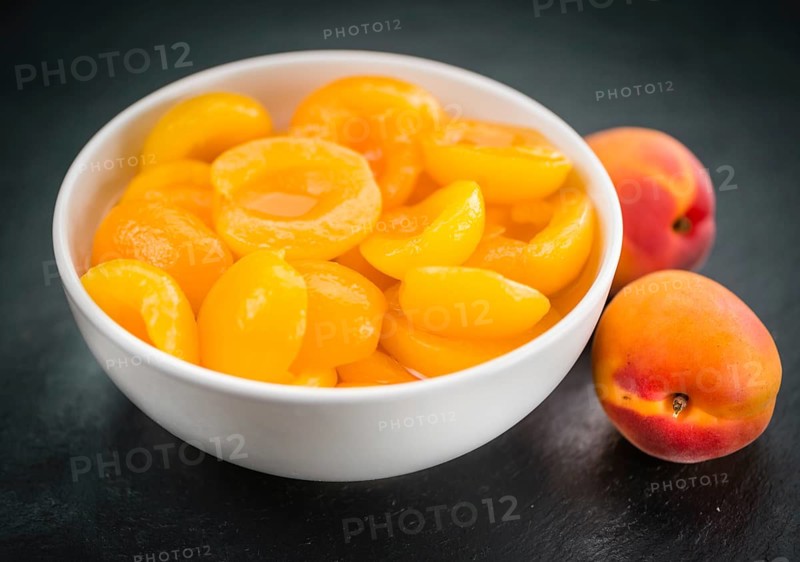 Some Pickled Apricots on a vintage slate slab (selective focus)