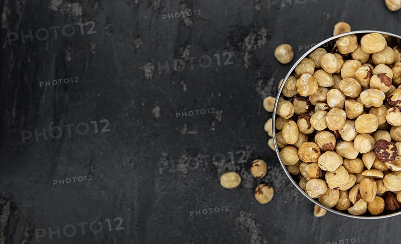Peeled Hazelnuts as detailed close up shot (selective focus)