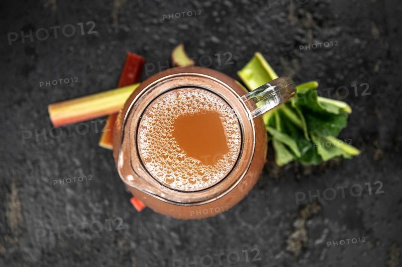 Portion of fresh made Rhubarb Juice (close up shot, selective focus)