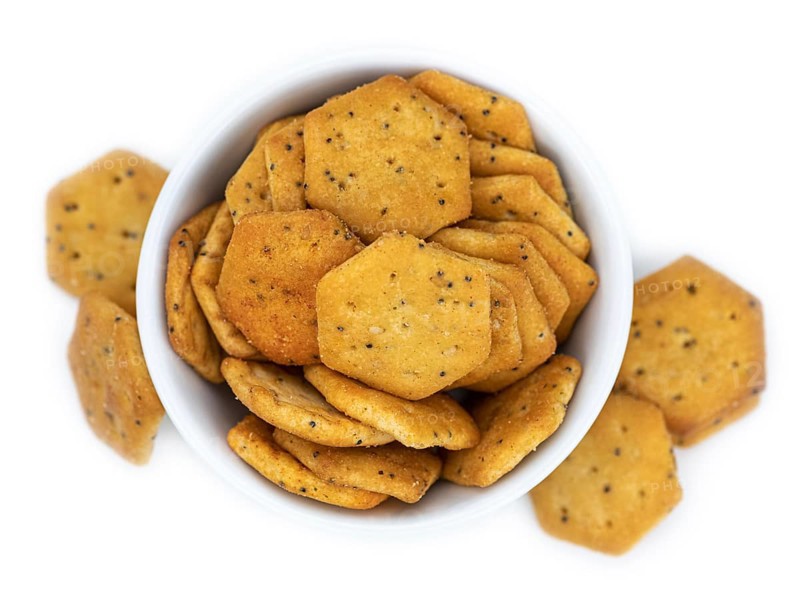 Portion of mixed Snacks isolated on white background (detailed close up shot, selective focus)