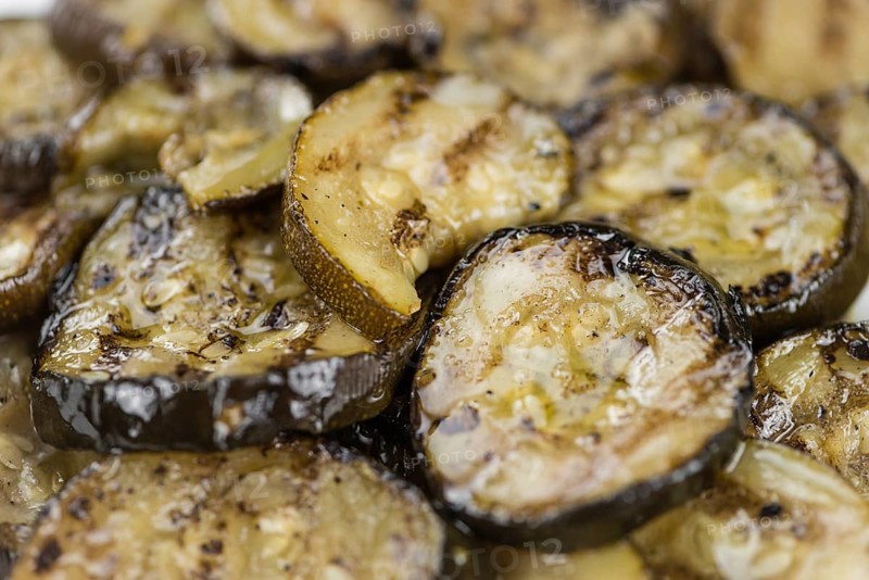 Grilled Zucchinis on a vintage background as detailed close-up shot (selective focus)