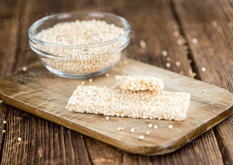 Some fresh made Quinoa Bars on vintage background (close-up shot)