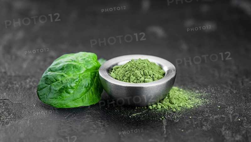 Freshly made green spinach powder (detailed close up shot, selective focus)
