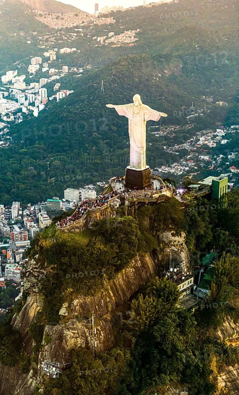 Cristo Redentor statue in Rio de Janeiro (aerial shot made from a helicopter) during a spectacular sunset