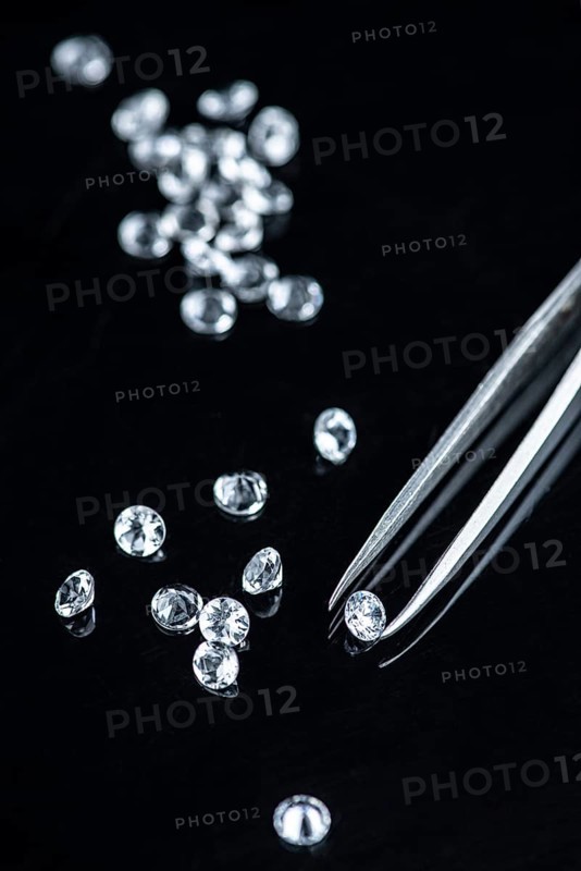 Small Diamonds on dark background as close up shot (selective focus)