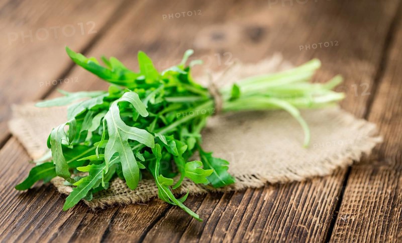 Portion of fresh Arugula (detailed close-up shot, selective focus)
