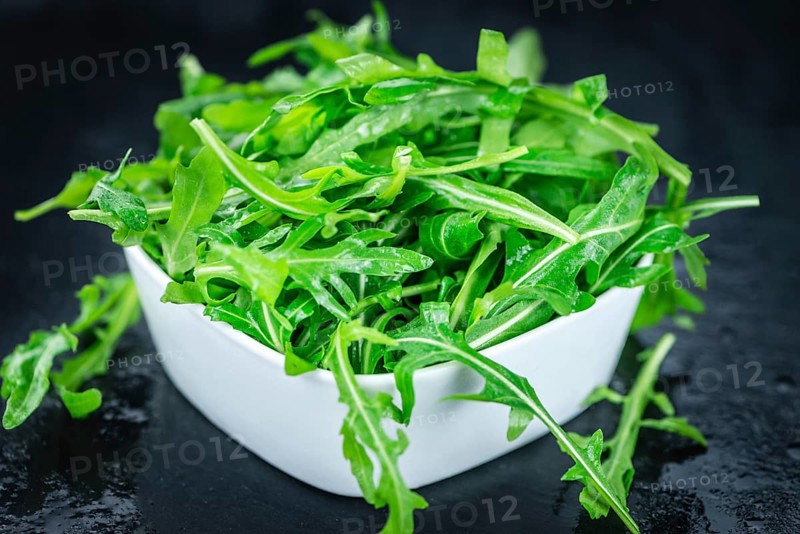 Portion of fresh Arugula (detailed close-up shot, selective focus)