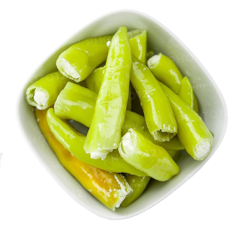 Pimientos (filled with cream cheese) isolated on white background (selective focus, close-up shot)
