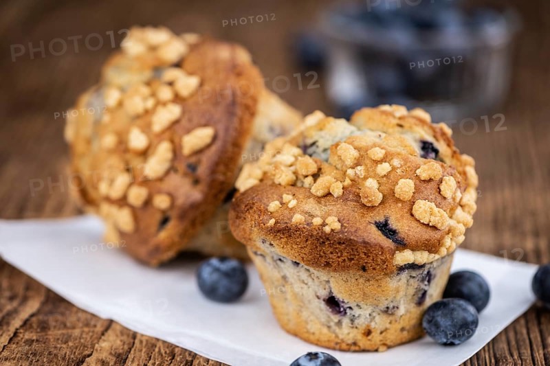 Some fresh Blueberry Muffins (selective focus, close-up shot)