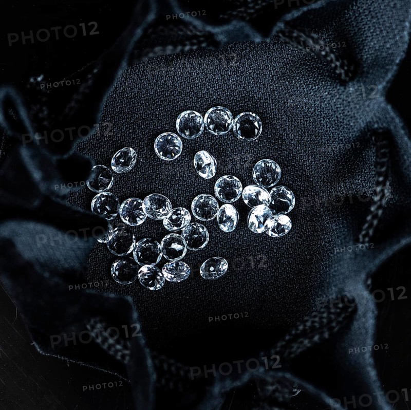 Small Diamonds on dark background as close up shot (selective focus)