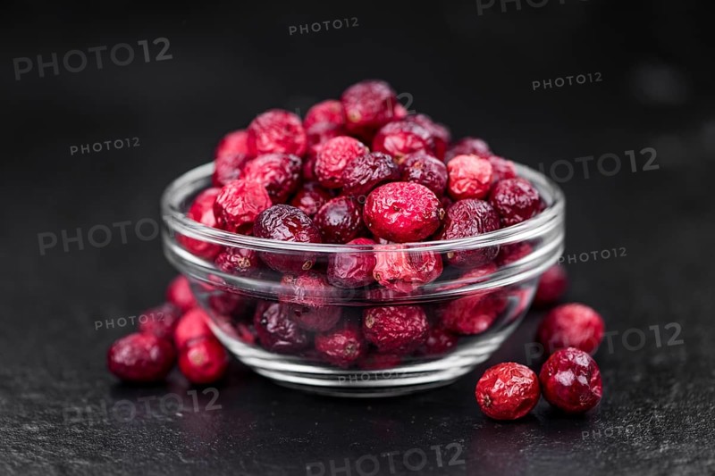Portion of fresh made Dried Cranberries on a slate slab (selective focus)