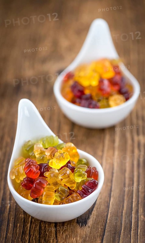 Fruity Gummy Bears (close-up shot) on an old wooden table