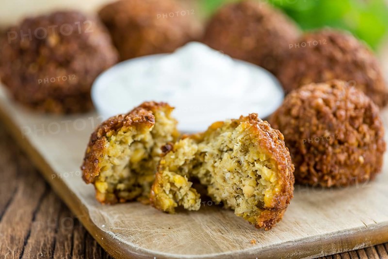 Falafel (close-up shot, selective focus) on an old wooden table