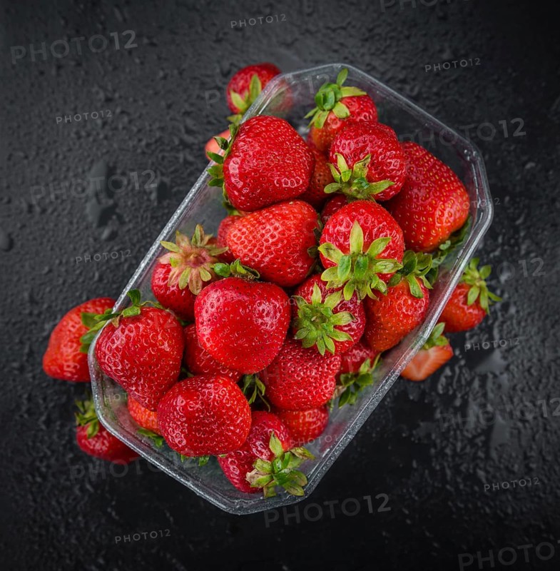 Strawberries on a vintage background as detailed close-up shot, selective focus