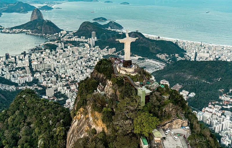 Cristo Redentor statue in Rio de Janeiro (aerial shot made from a helicopter) during a spectacular sunset