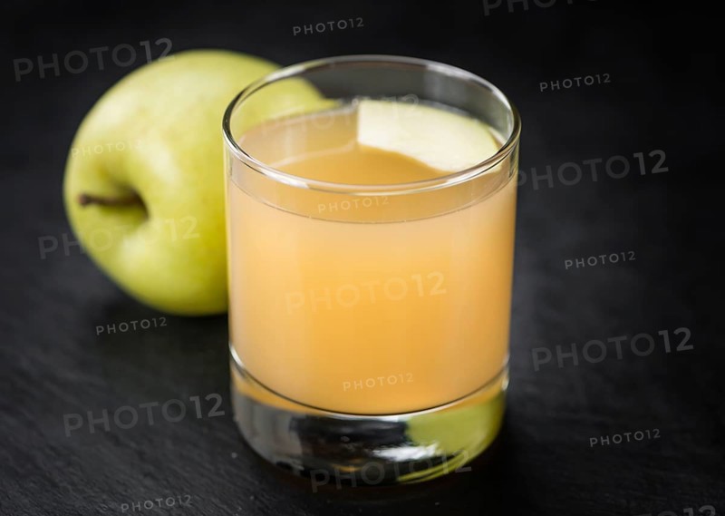 Fresh made Juice (apple) on a vintage background (close-up shot)
