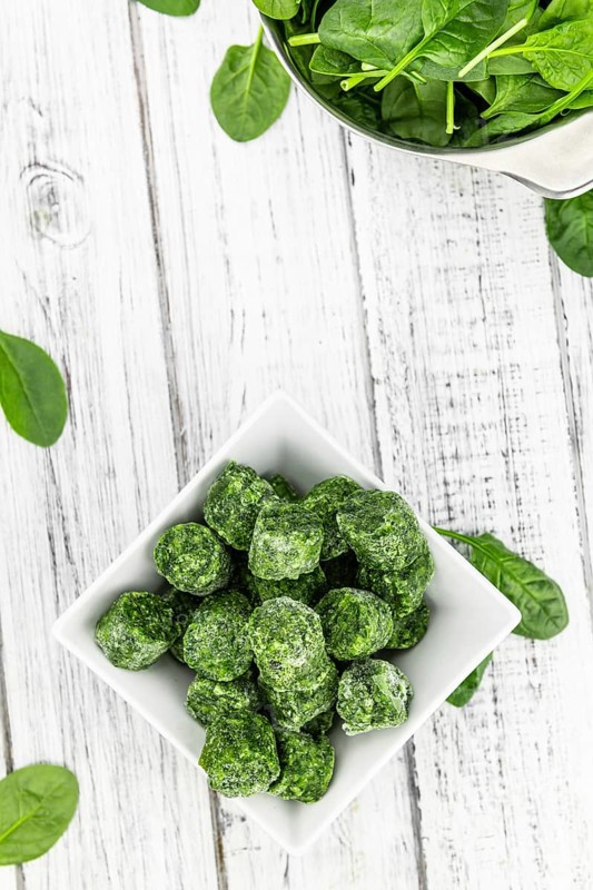 Frozen spinach cubes as detailed close up shot (selective focus)