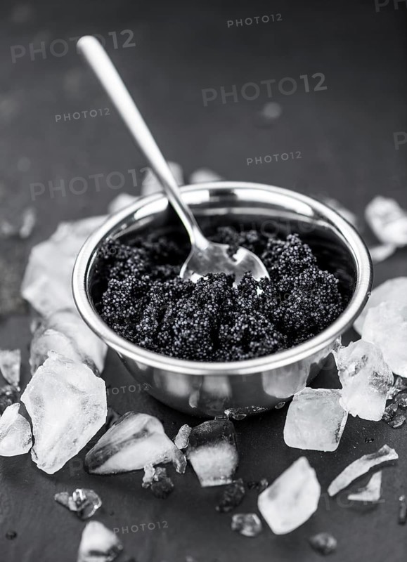 Caviar on a vintage looking slate slab (selective focus)