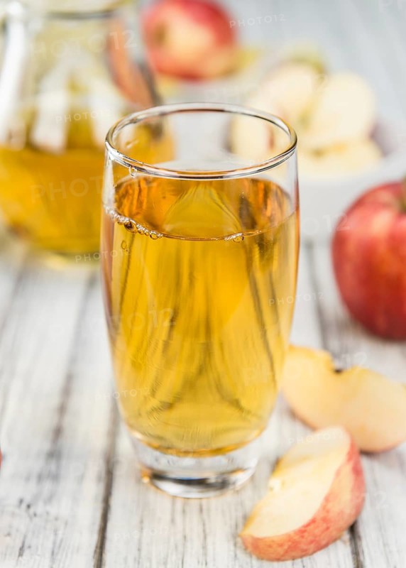 Apple Cider on a vintage background as detailed close-up shot (selective focus)