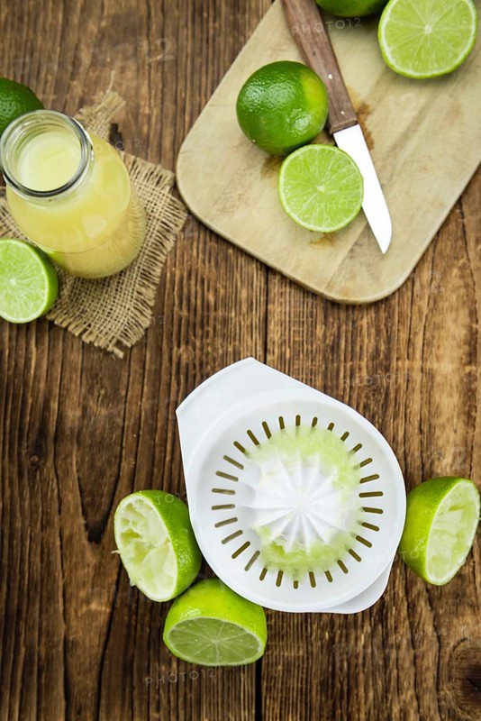 Portion of fresh Lime Juice (close-up shot, selective focus)