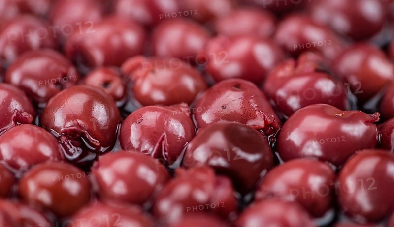 Preserved Cherries on a vintage background as detailed close-up shot, selective focus