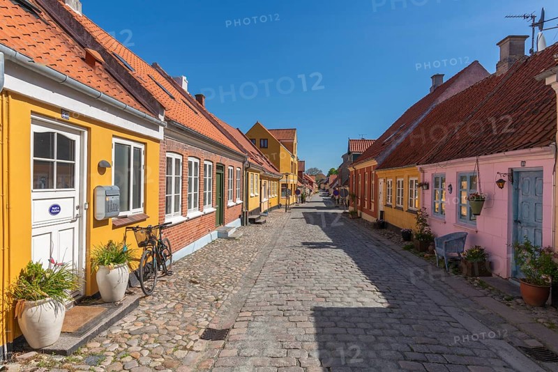 Old town of Rudkobing, renovated houses, colourful row of houses, dormers, decorative design, bicycle, potted plants, traffic-free street with cobblestones, Langeland island, Sydfyn, South Funen, Baltic Sea, Danish South Sea, Denmark, Europe