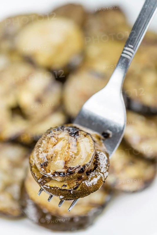 Homemade Antipasti (Grilled Zucchinis) on vintage background (selective focus, close-up shot)