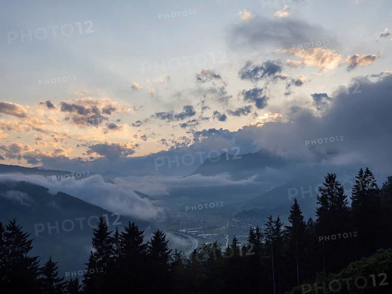 Evening clouds and fog over the Liesingtal, in the valley the village of Traboch, Schoberpass federal road, view from the lowlands, Leoben, Styria, Austria, Europe