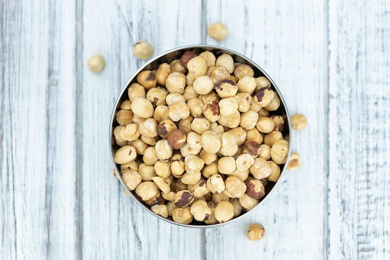 Peeled Hazelnuts as detailed close up shot (selective focus)