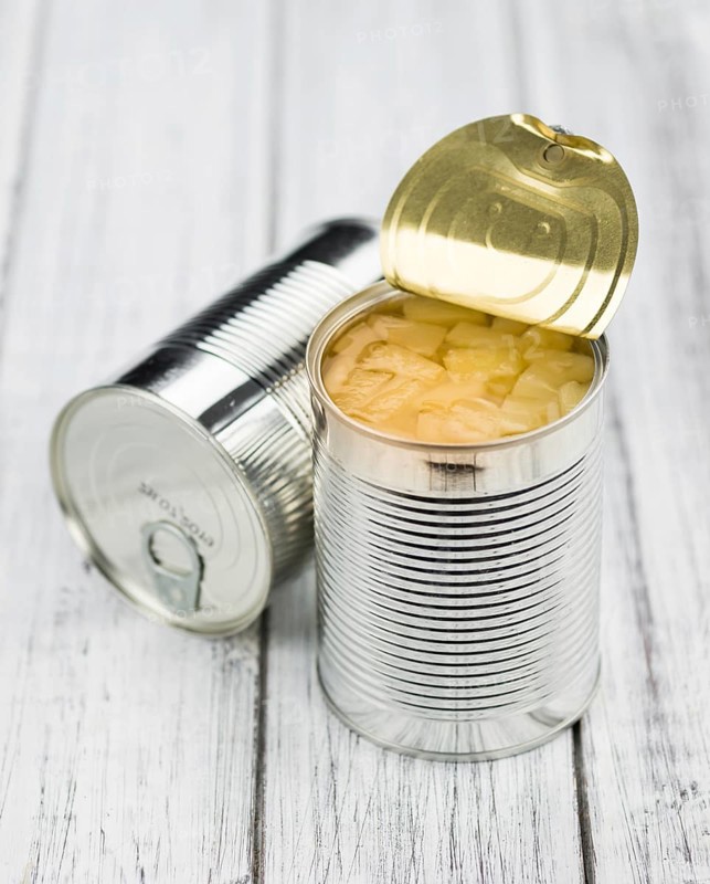 Preserved Pineapple pieces on a vintage background as detailed close-up shot, selective focus