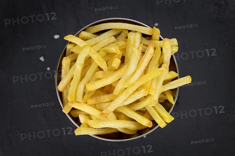 Portion of homemade French Fries (close-up shot, selective focus)