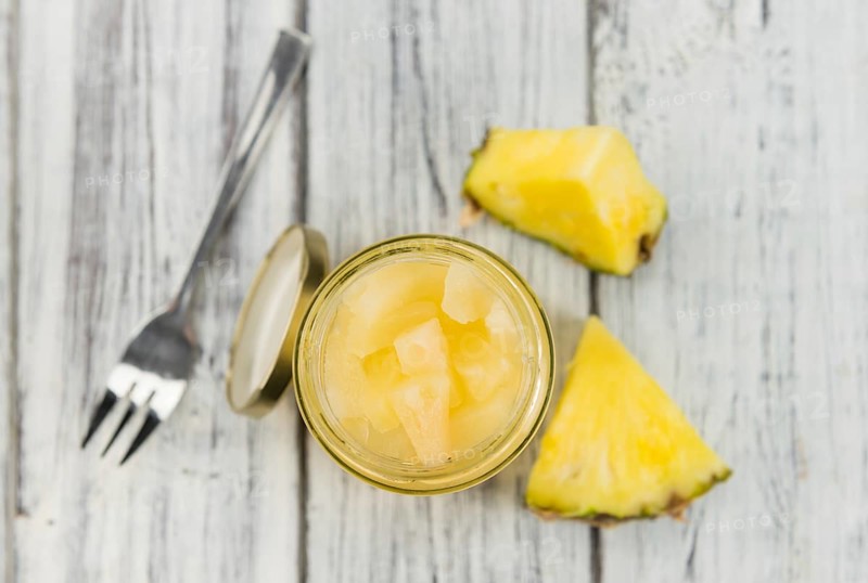 Portion of fresh Preserved Pineapple pieces close-up shot, selective focus
