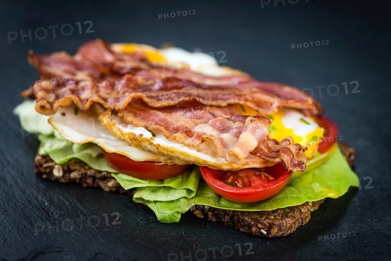 Portion of Bacon and Eggs (selective focus, close-up shot)