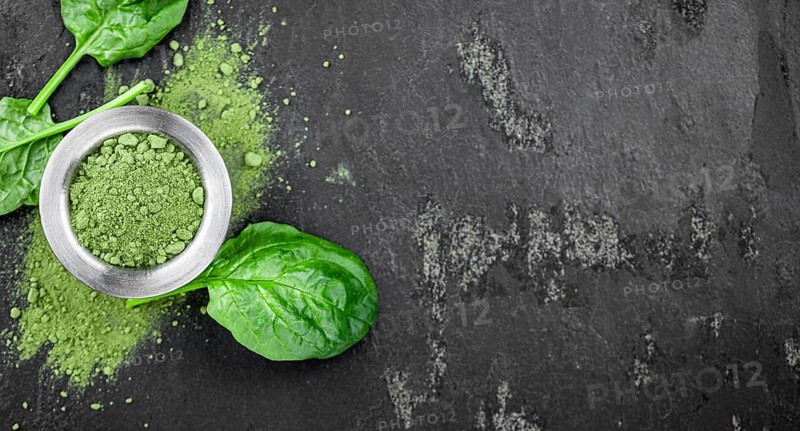 Freshly made green spinach powder (detailed close up shot, selective focus)