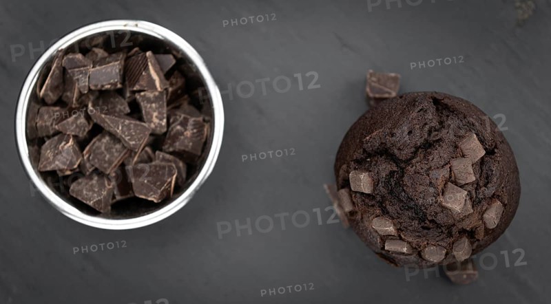 Portion of healthy Chocolate Muffins on a slate slab (selective focus)
