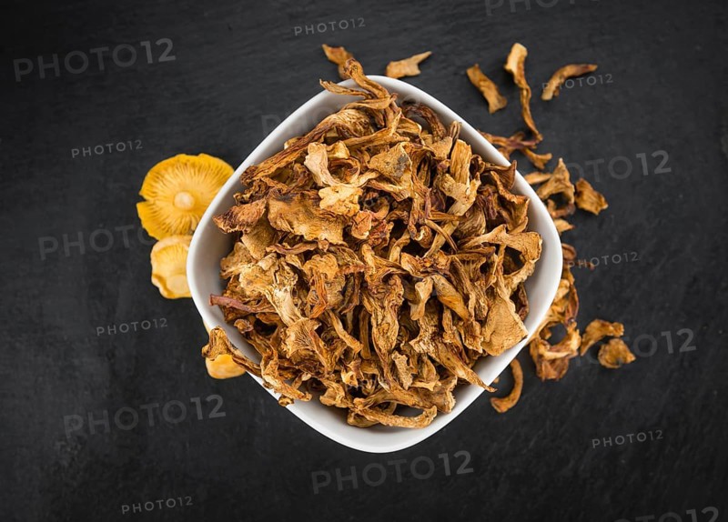 Fresh made Dried Chanterelles on a vintage background as detailed close-up shot