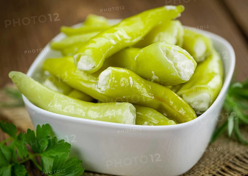 Some homemade Green Chilis (filled with cheese) (selective focus) as detailed close-up shot