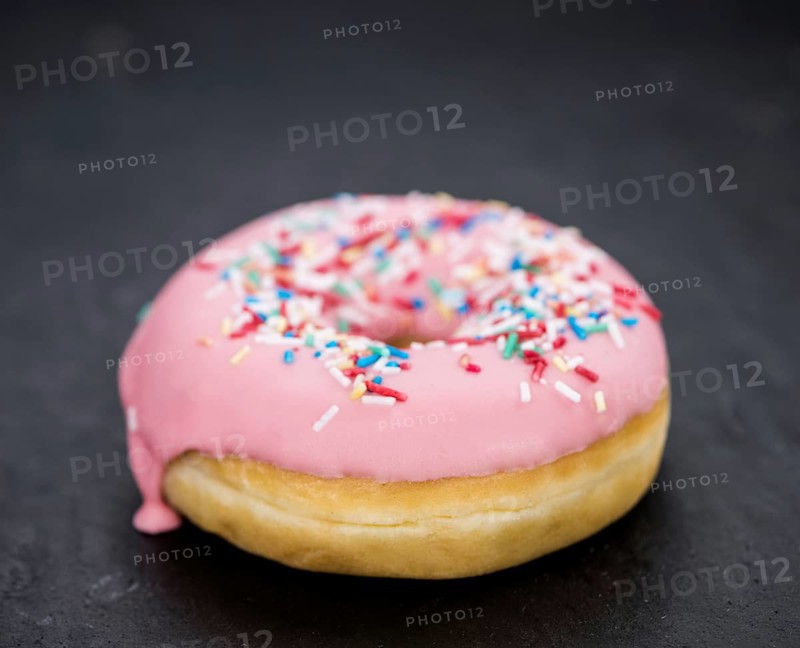 Portion of some Donuts as detailed close-up shot (fresh made, selective focus)