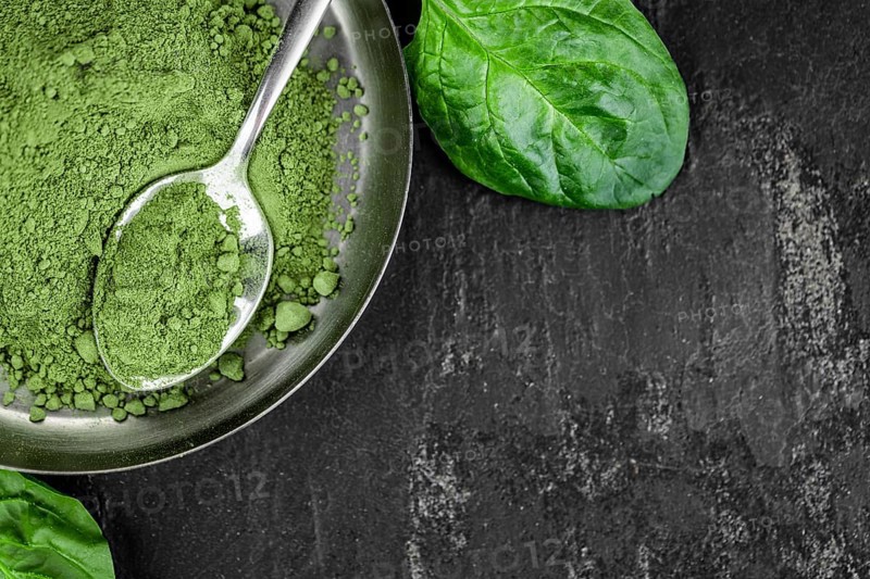 Homemade green spinach powder (close up shot, selective focus)