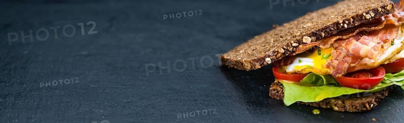 Fresh made Bacon and Egg Sandwich (selective focus, close-up shot)