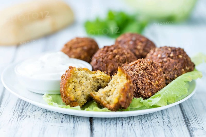 Wooden table with Falafels (close-up shot, selective focus)