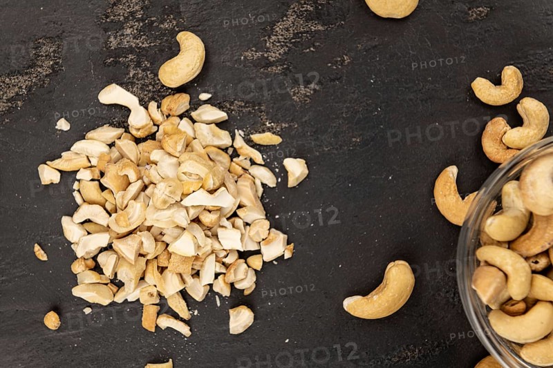 Portion of chopped Cashew nuts (close-up shots, selective focus)