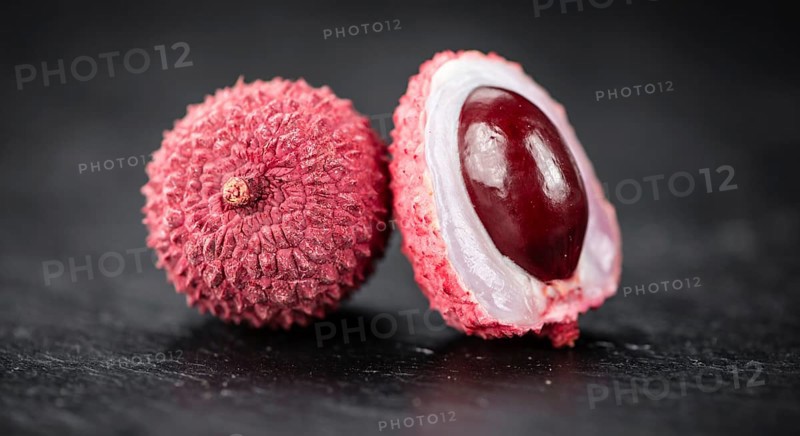 Portion of Litchis as detailed close up shot on a slate slab (selective focus)