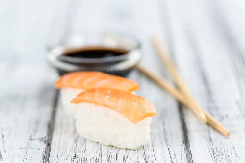 Some fresh made Sushi on a wooden table (selective focus, close-up shot)