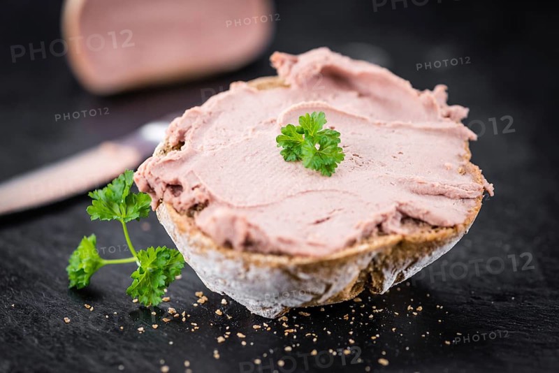 Liverwurst Sandwich on a vintage background as detailed close-up shot (selective focus)