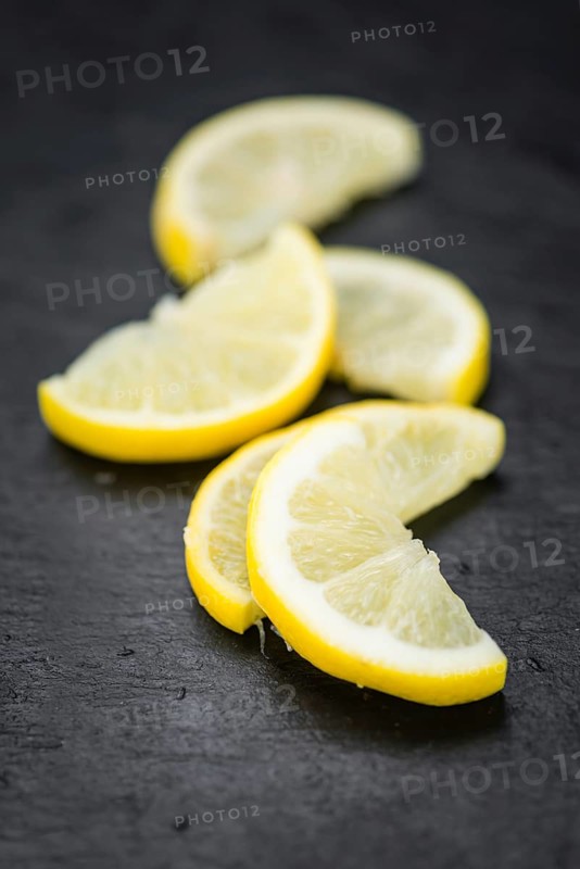 Some Lemon Slices on a vintage slate slab (selective focus)