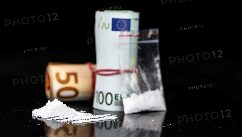 Dark plate with a portion of Cocaine as close-up shot
