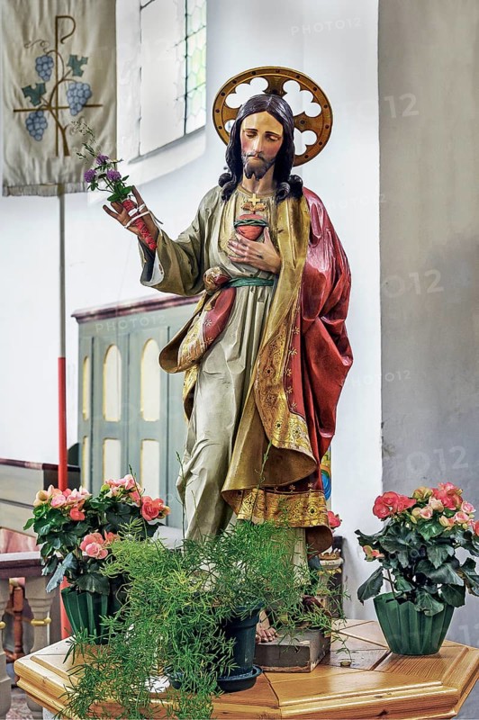 Jesus figure with floral decoration, St Martin's Church from 1746 in Eisenbach, Kreuzthal, Markt Buchenberg, Allgäu, Swabia, Bavaria, Germany, Europe