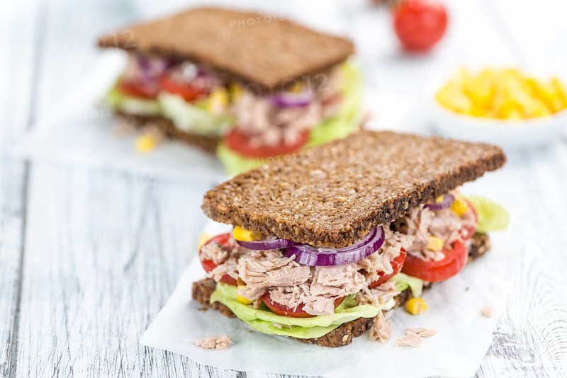 Tuna Sandwich (wholemeal bread, selective focus) on an old wooden table
