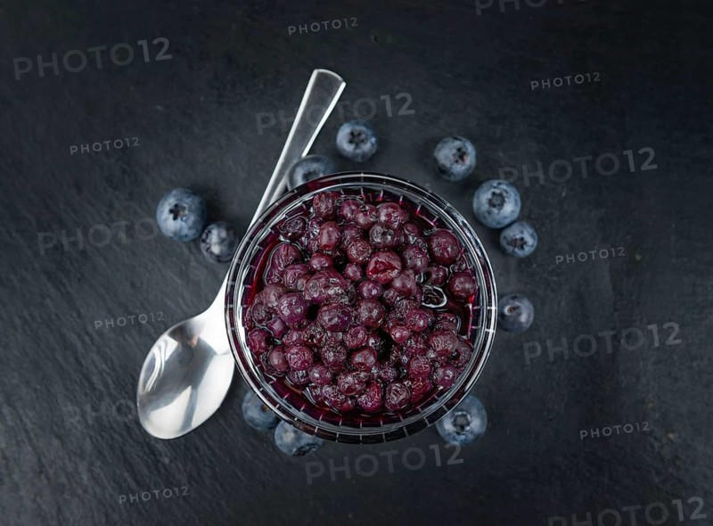 Canned Blueberries on a vintage slate slab as detailed close-up shot, selective focus